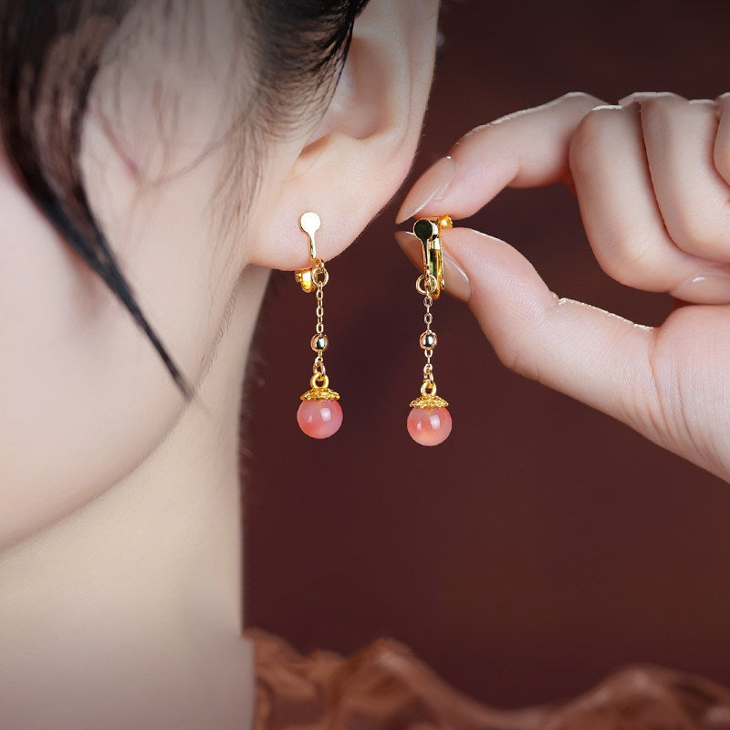 Pink stone dangles earrings, close detail