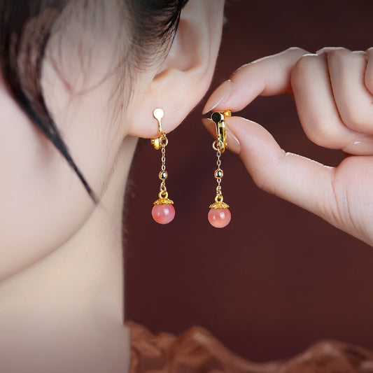 Pink stone dangles earrings, close detail