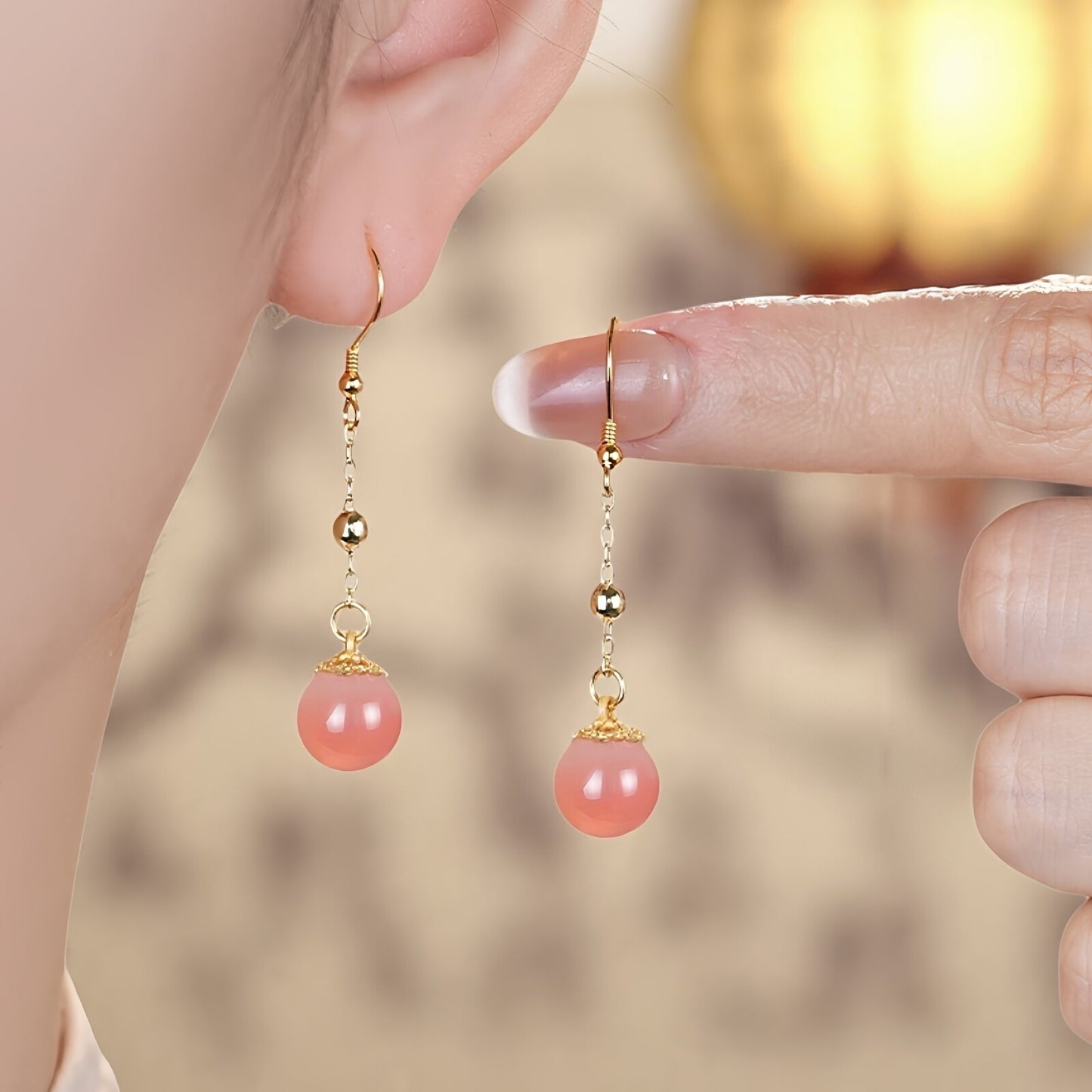 Pink stone dangles earrings, front view