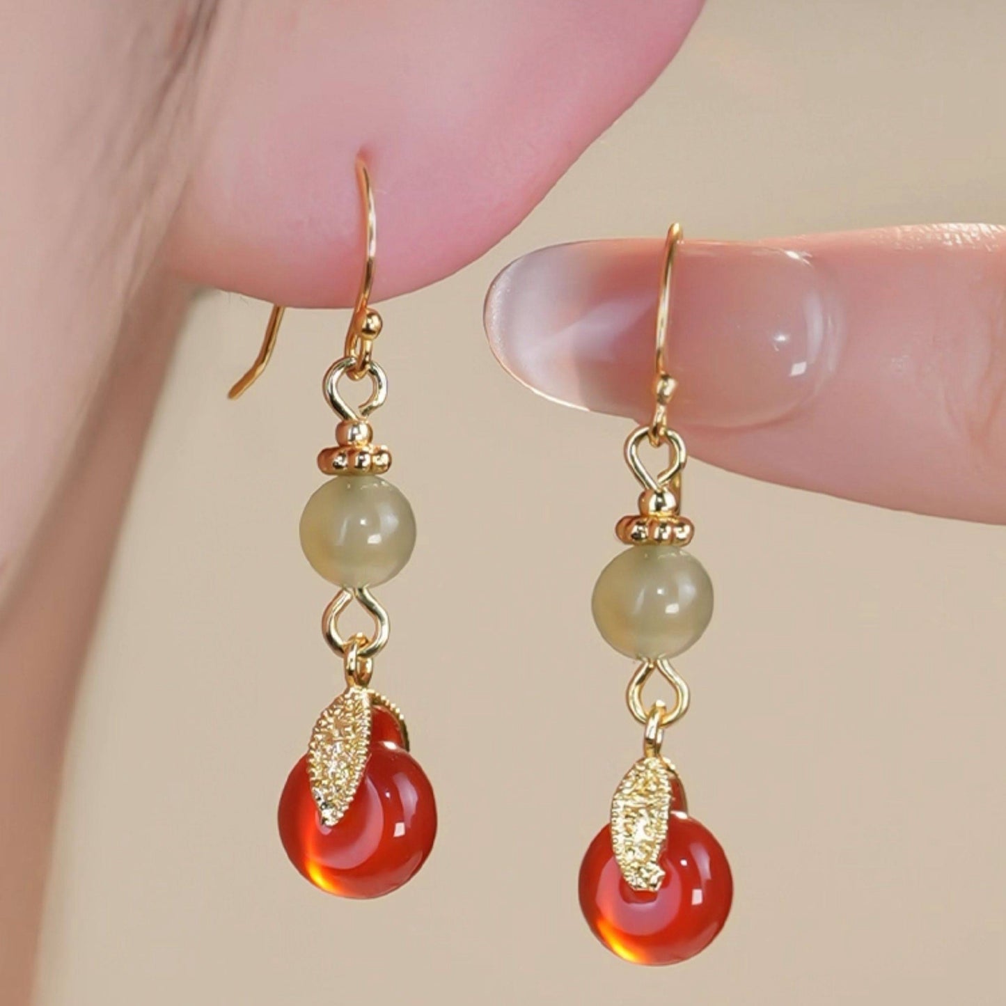 Red and green bead drops earrings, front view