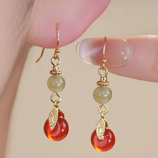 Red and green bead drops earrings, front view