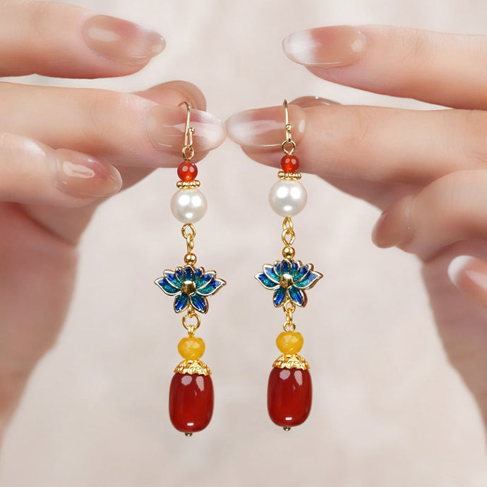 Blue lotus and red bead drops earrings, side profile