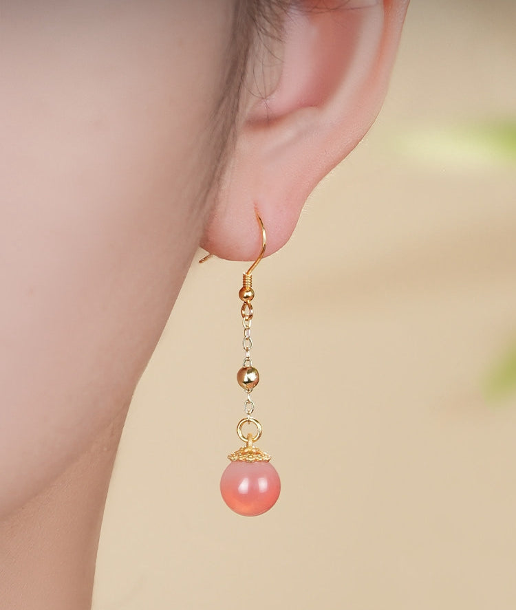 Pink stone dangles earrings, worn styling view