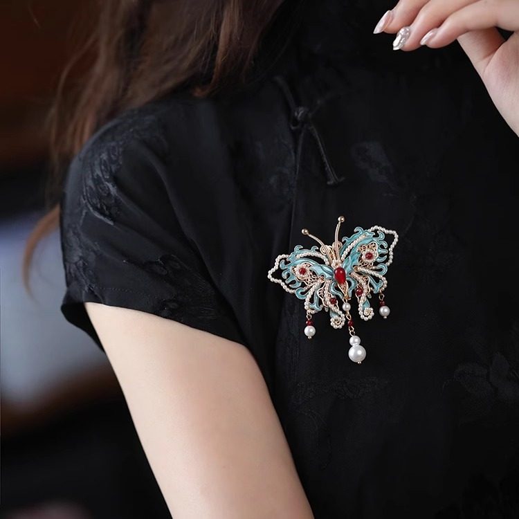 butterfly statement brooch with pearl drop detail