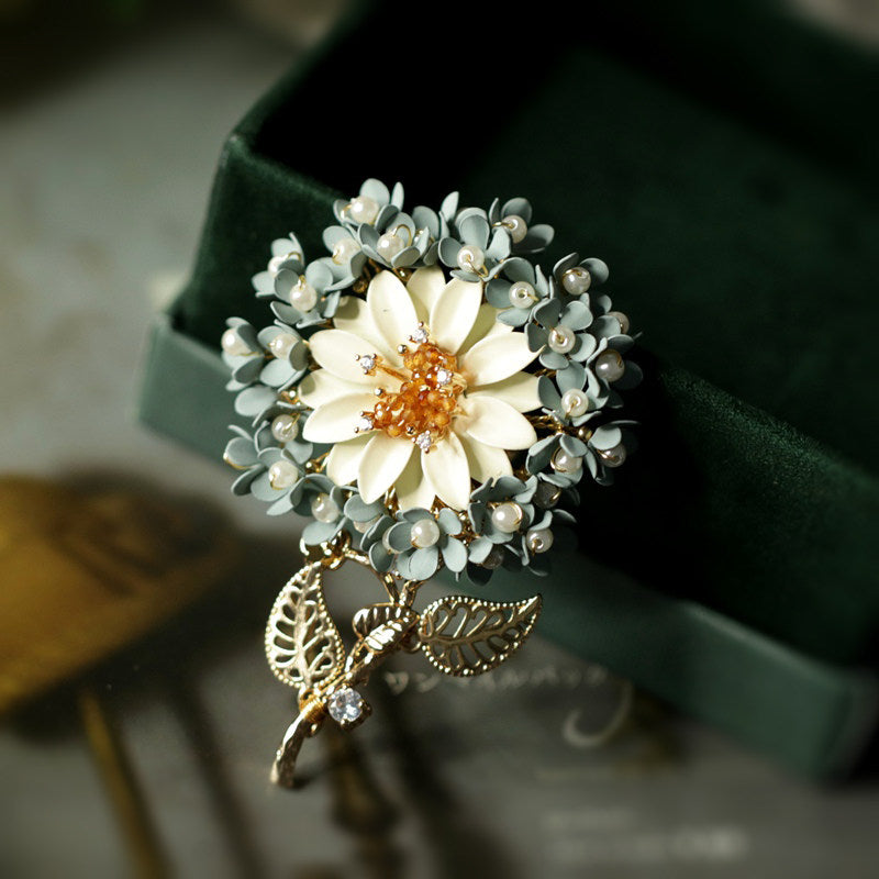 Close-up of sculpted petal detail with warm gold finish and pearlescent center