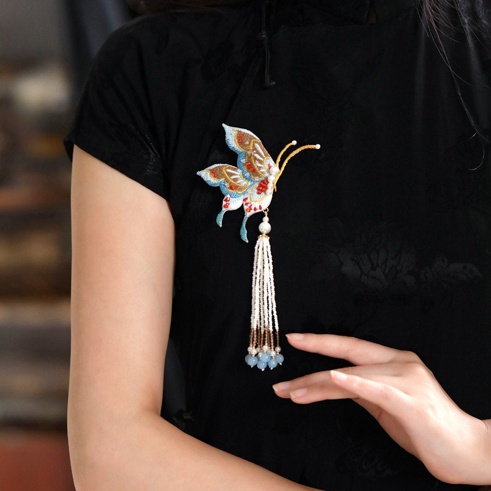 tassel butterfly brooch pin on a Qipao