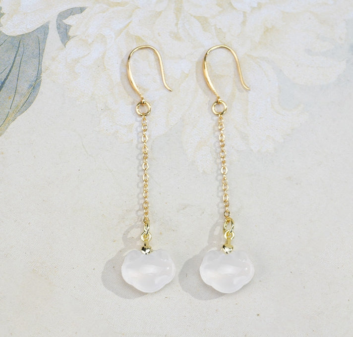 White stone ruyi drops earrings, side profile