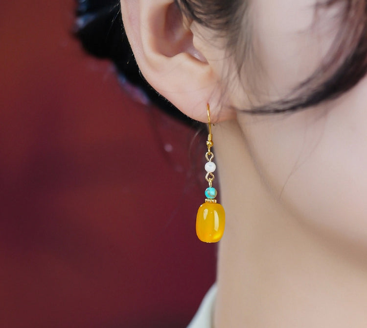 Yellow stone and pearl drops earrings, close detail